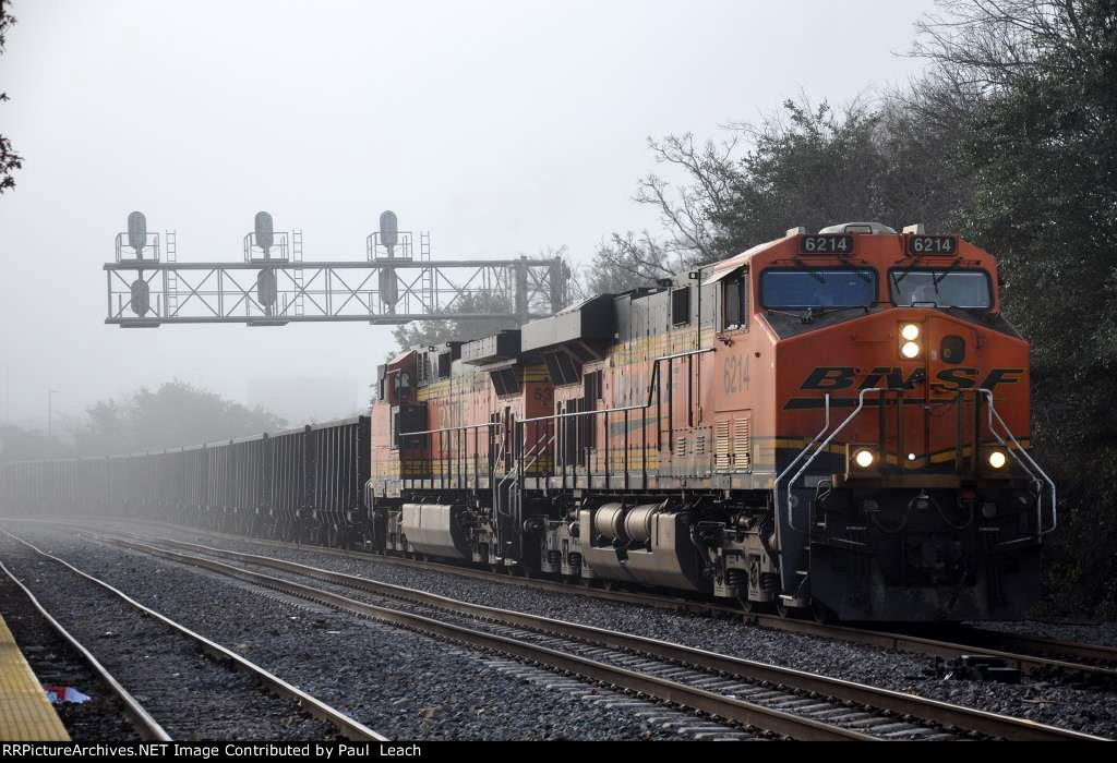 Westbound rock train through the fog